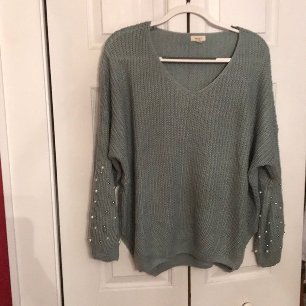 Sweater with embellished sleeves
